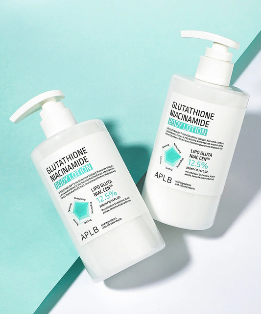 Two bottles of APLB Glutathione Niacinamide body lotion on a light blue background