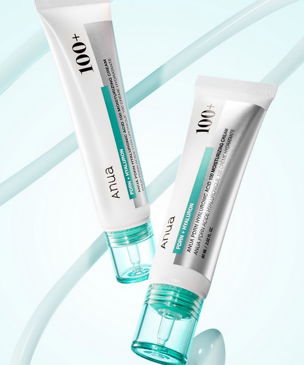 Two tubes of ANUA 100+ cream on a light blue background