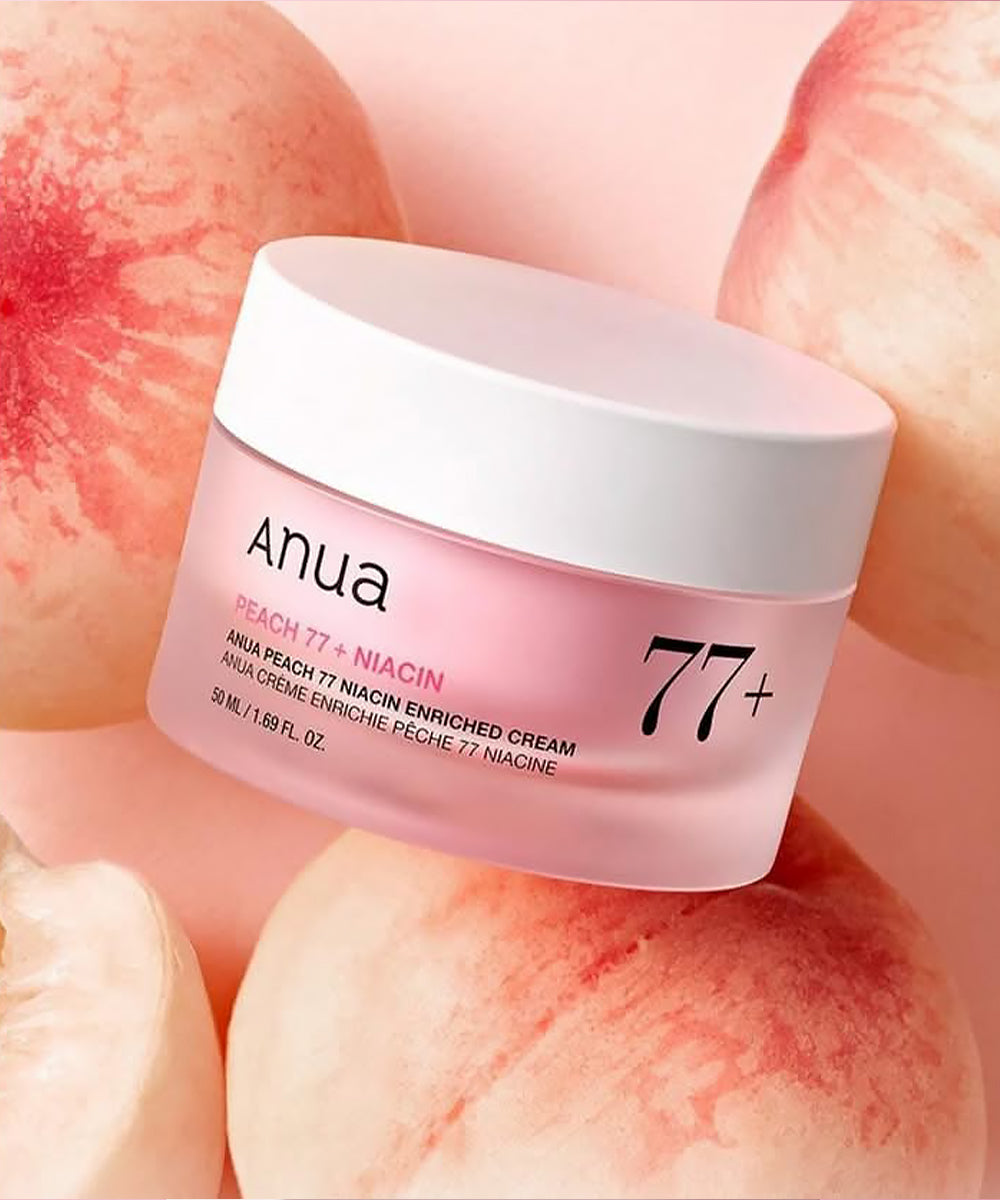 Anua Peach 77+ Niacin enriched cream jar with peach slices in the background