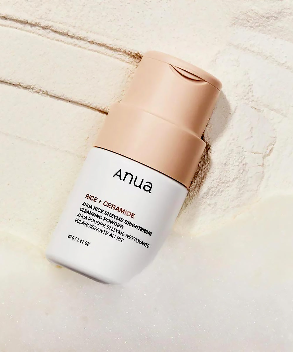 Anua skincare product on a textured beige background