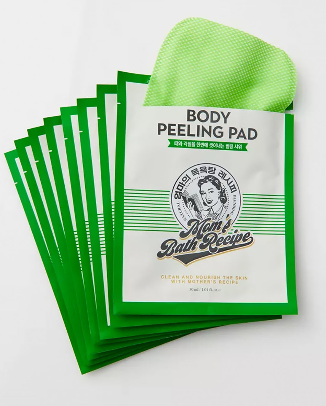 Stack of 'Mom's Bath Recipe' body peeling pads with a green pad on top.