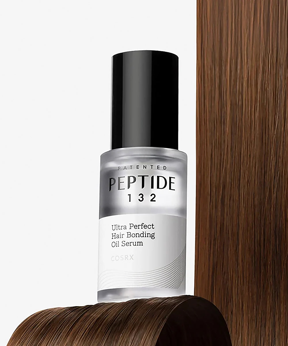 Peptide 132 hair serum bottle with a wooden background