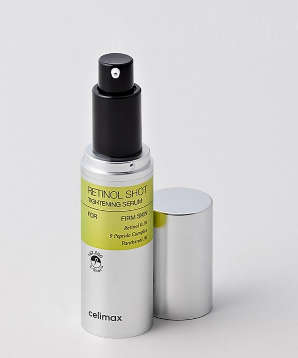Retinol shot serum bottle with black spray nozzle on a light gray background