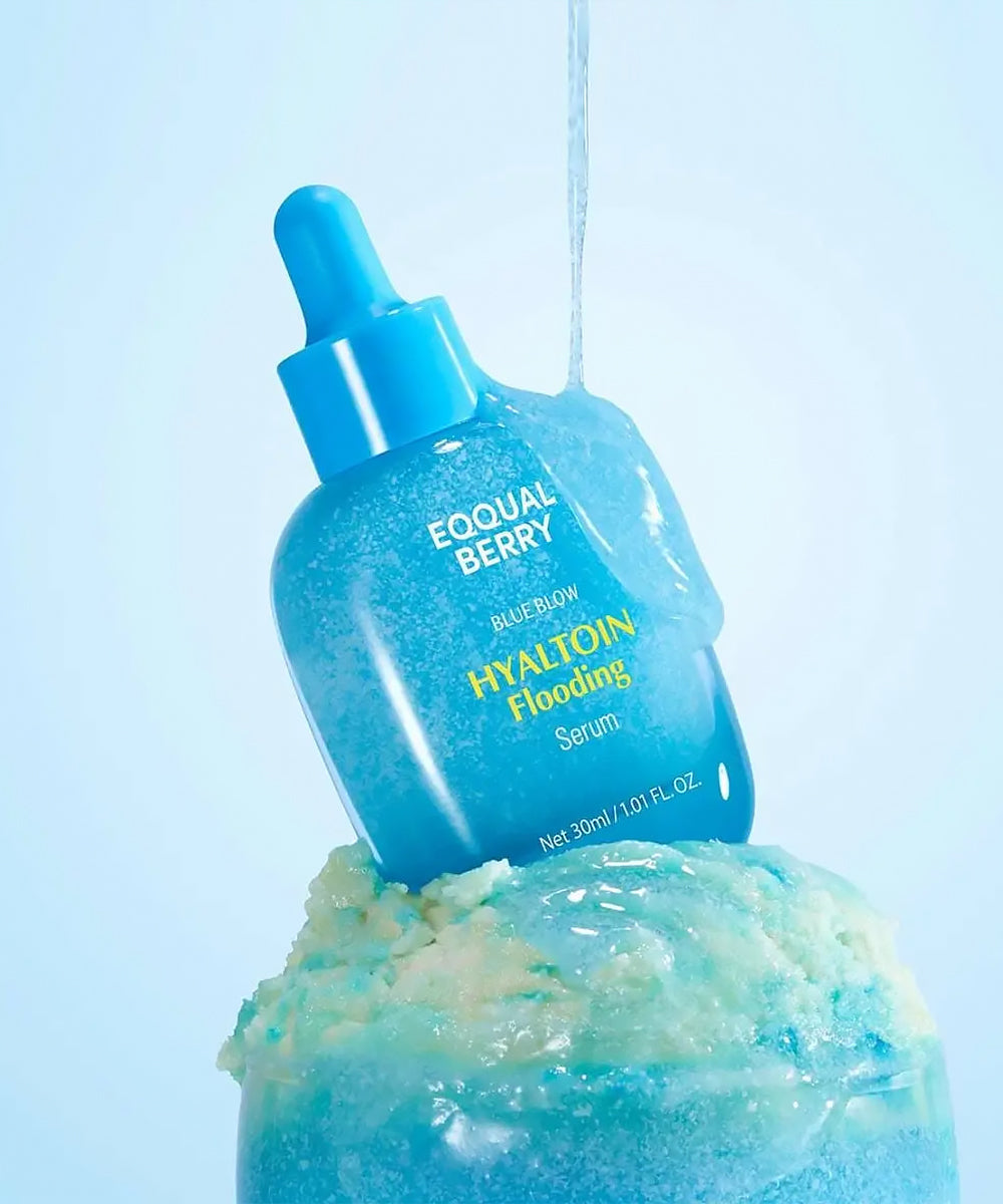 Blue skincare serum bottle with dropper on a light blue background