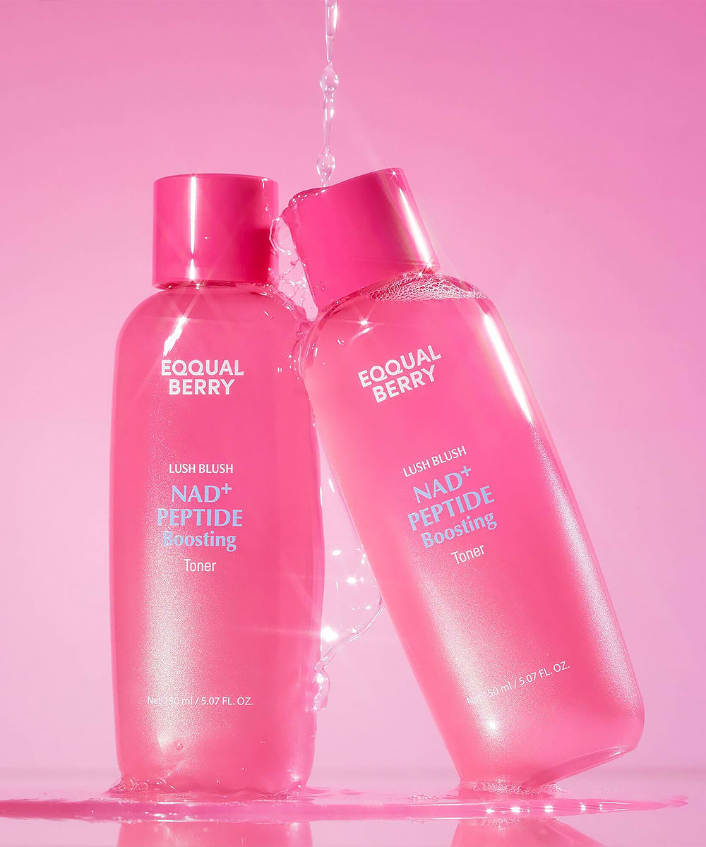 Two pink bottles of Eqqual Berry skincare products on a pink background