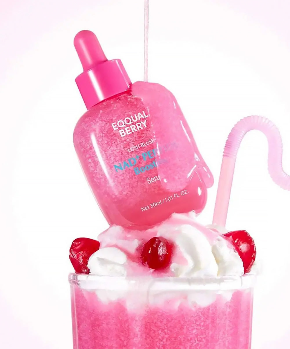 Pink bottle labeled 'Eqqual Berry' with a strawberry milkshake and cherry toppings on a white background