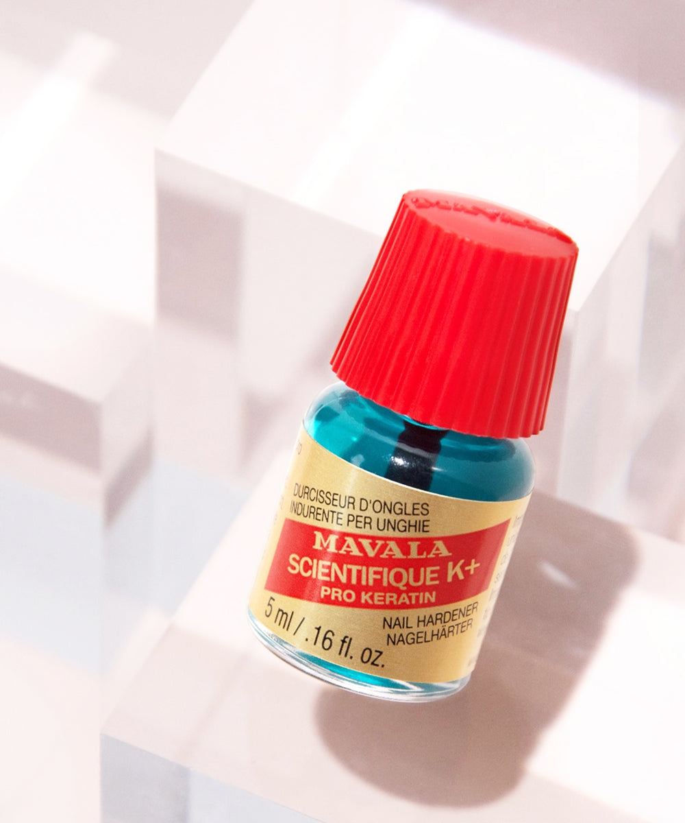 MAVALA Scientifique K+ nail hardener bottle with red cap on a light background