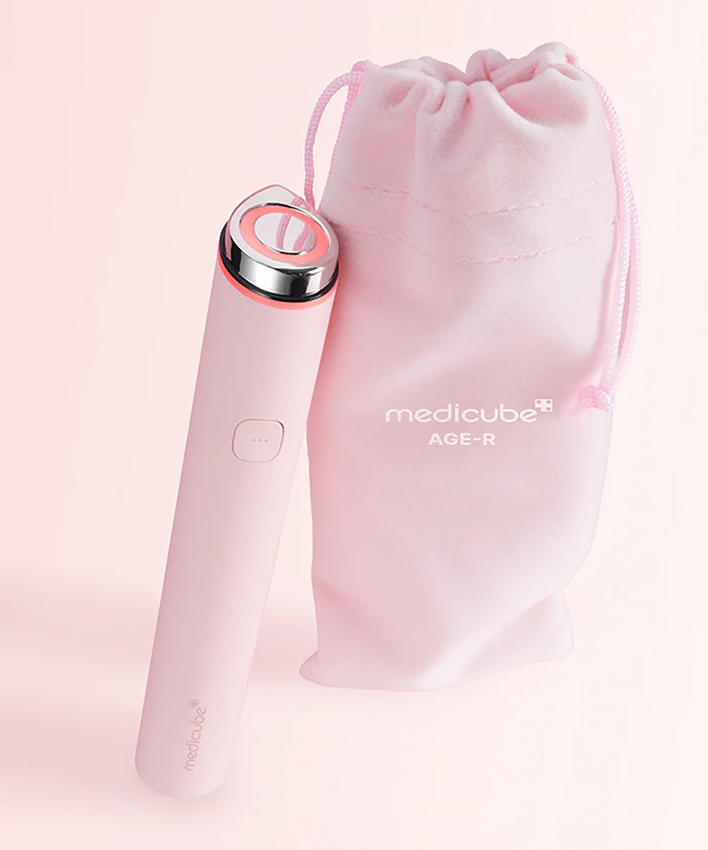 Pink beauty device with 'medicube' branding on a light pink background