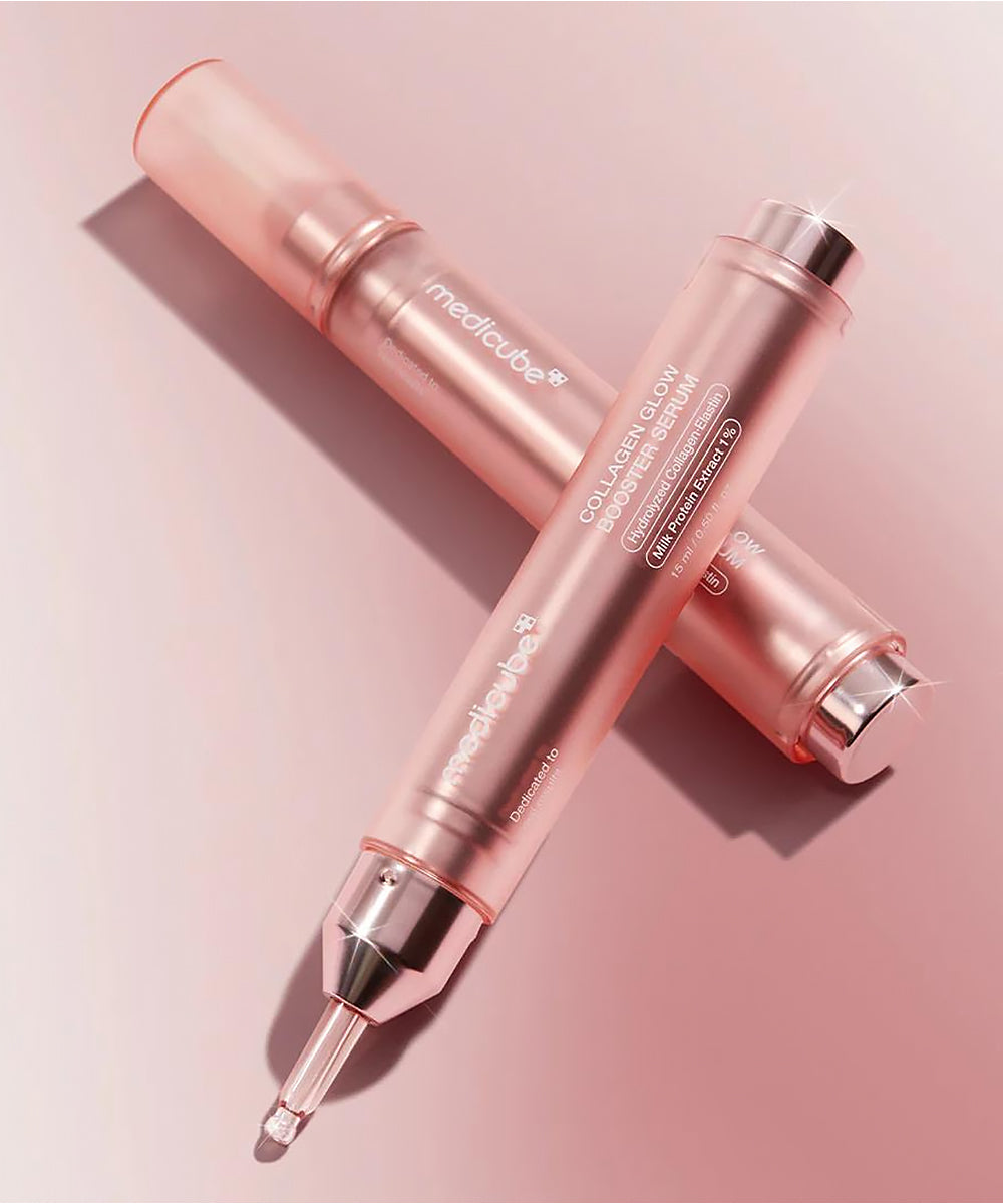 Two rose gold beauty devices on a pink background