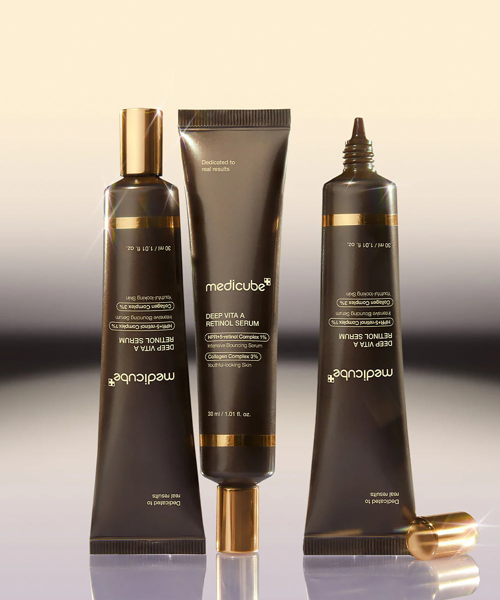 Three skincare products from Medicube on a gradient background