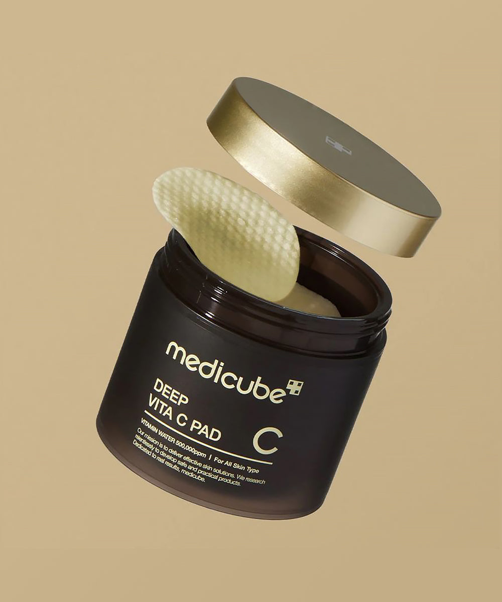 Medicube Deep Vita C Pad packaging with a beige background