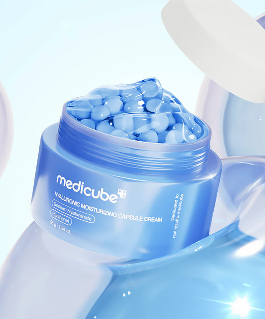 Medicube hyaluronic moisturizing capsule cream with blue capsules on a light blue background
