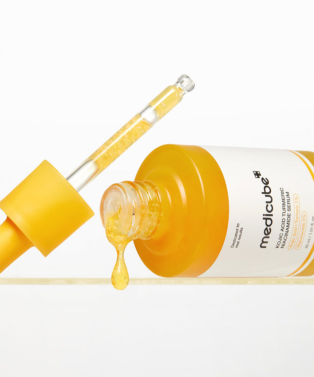 Medicube skincare dropper bottle with yellow liquid on a white background