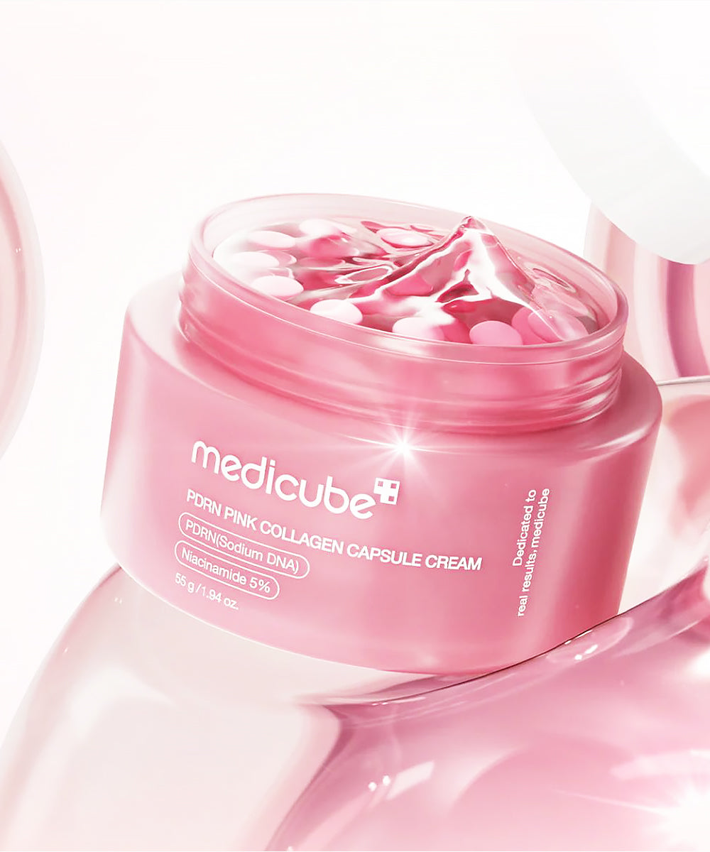 Pink jar of Medicube collagen capsule cream on a white background