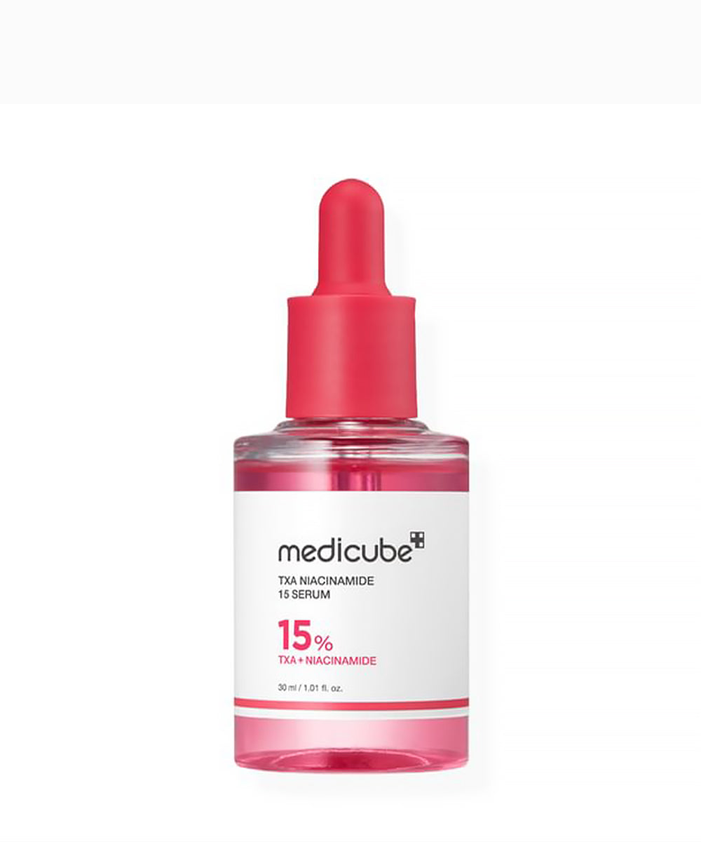 Medicube TXA Niacinamide 15 Serum bottle with pink cap on a white background