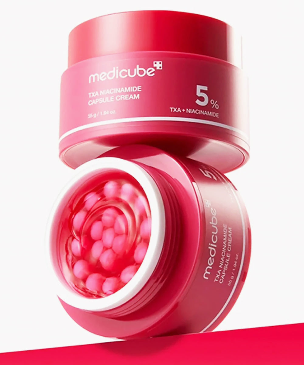 Red jar of Medicube TXA+Niacinamide Capsule Cream on a white background