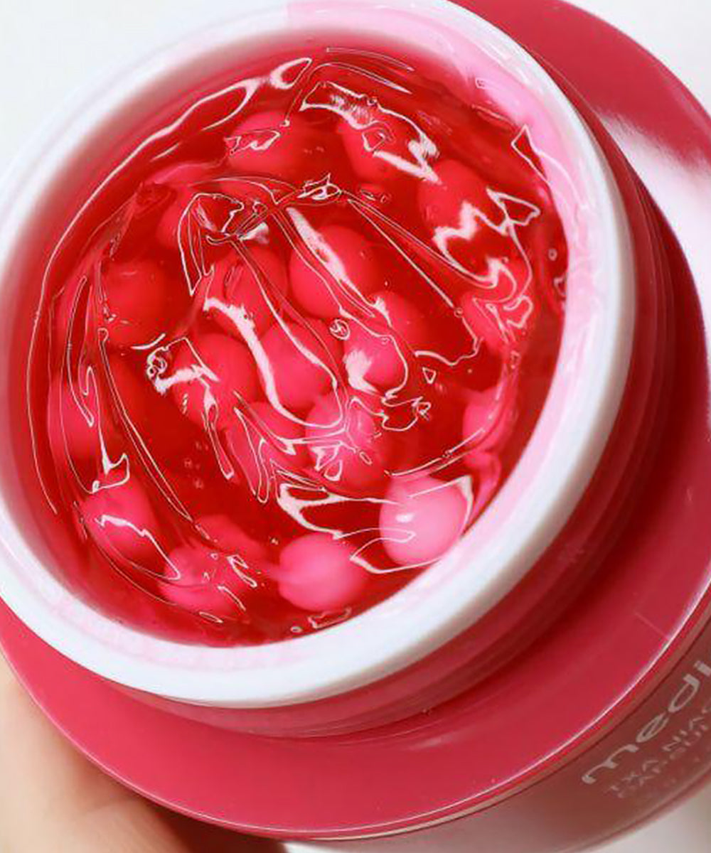Red gel-like substance in a pink container with 'Medicube' branding.