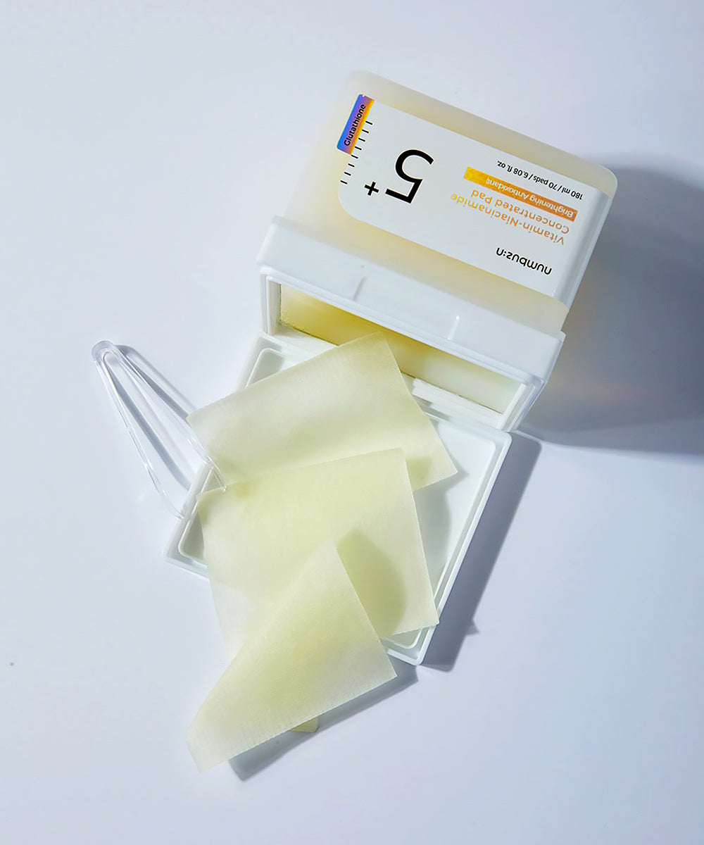 Pack of facial wipes with a clear lid on a white background