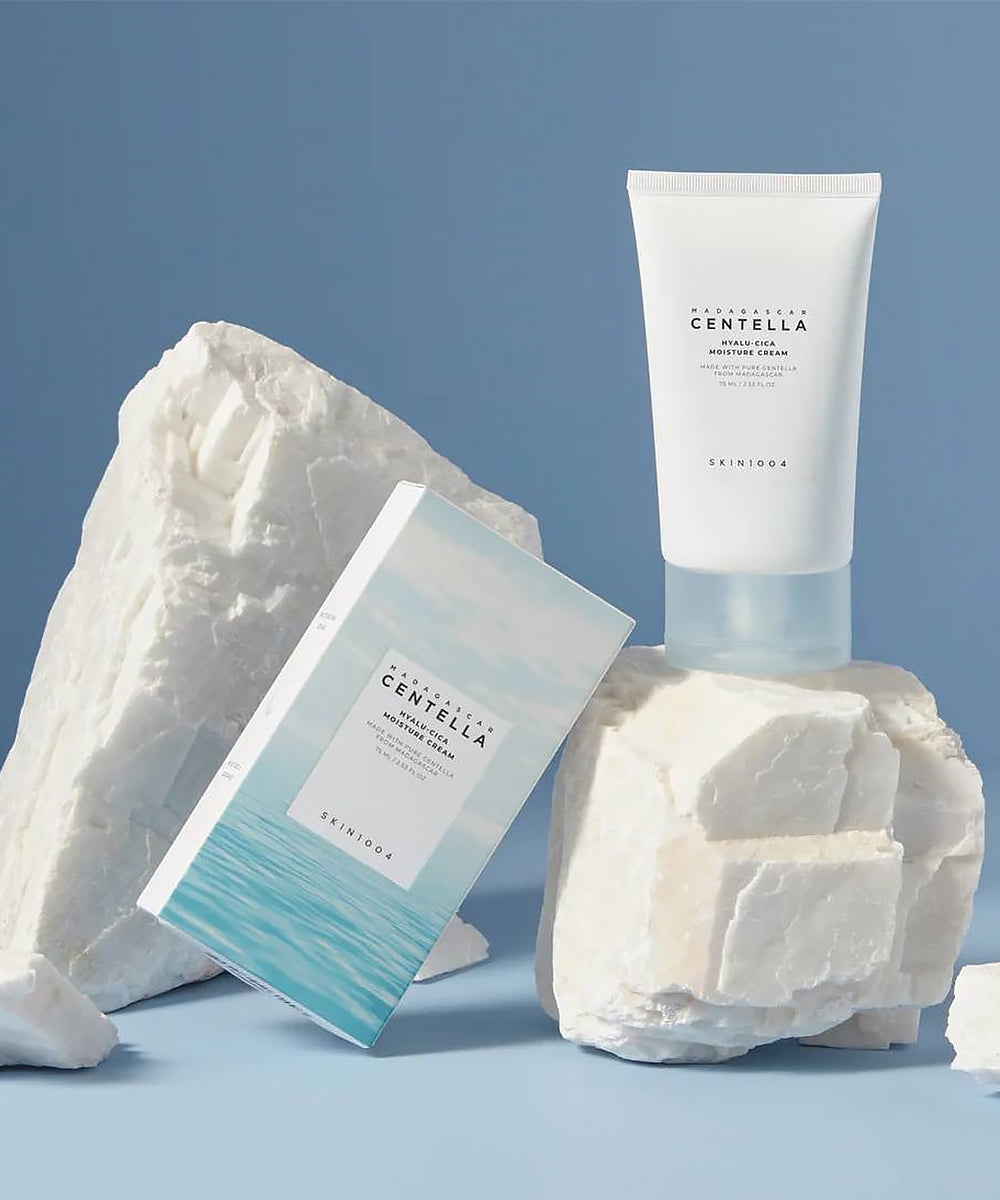 Skintifica Centella skincare products on a textured white surface with a blue background
