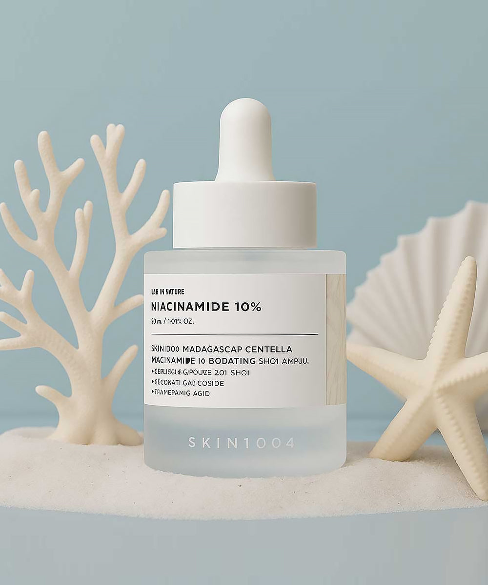 Skintouch niacinamide 10% skincare dropper bottle on a neutral background with decorative elements.