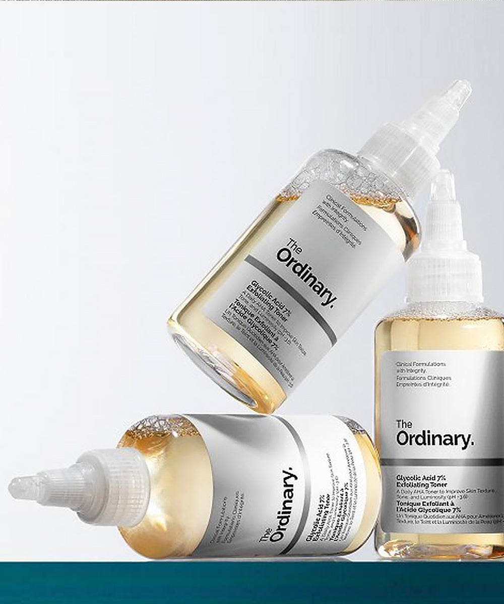 Three bottles of 'The Ordinary' skincare products on a white background