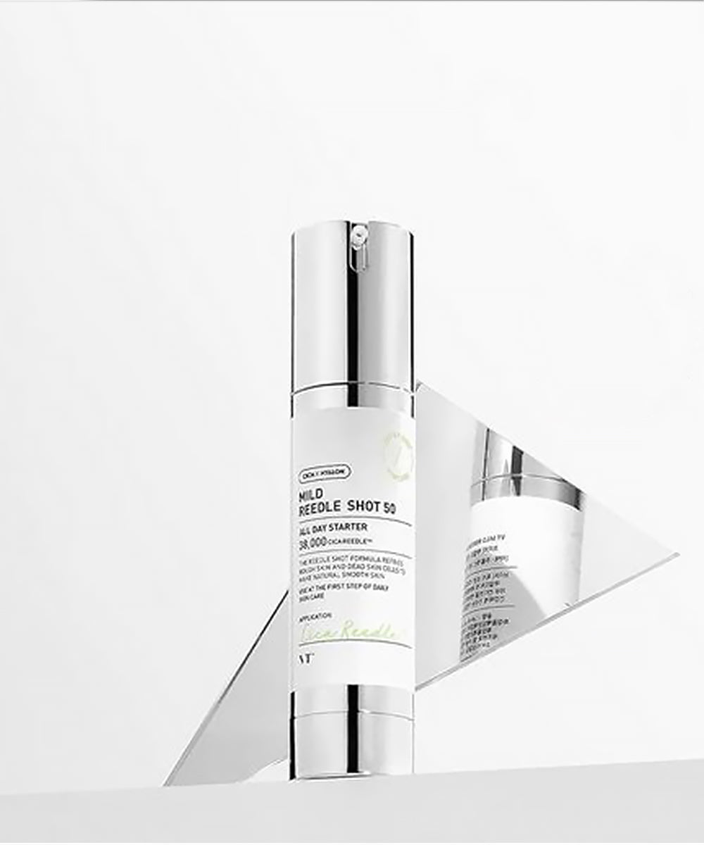Skincare serum bottle with metallic cap on a white background
