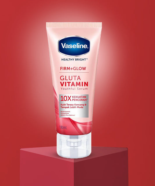 Vaseline Gluta Vitamin serum tube on a red background