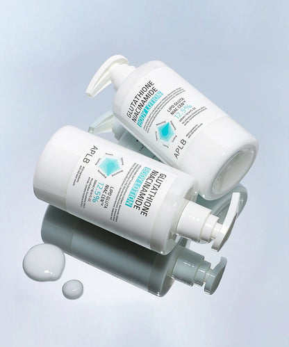 Two skincare bottles with pump dispensers on a light blue background