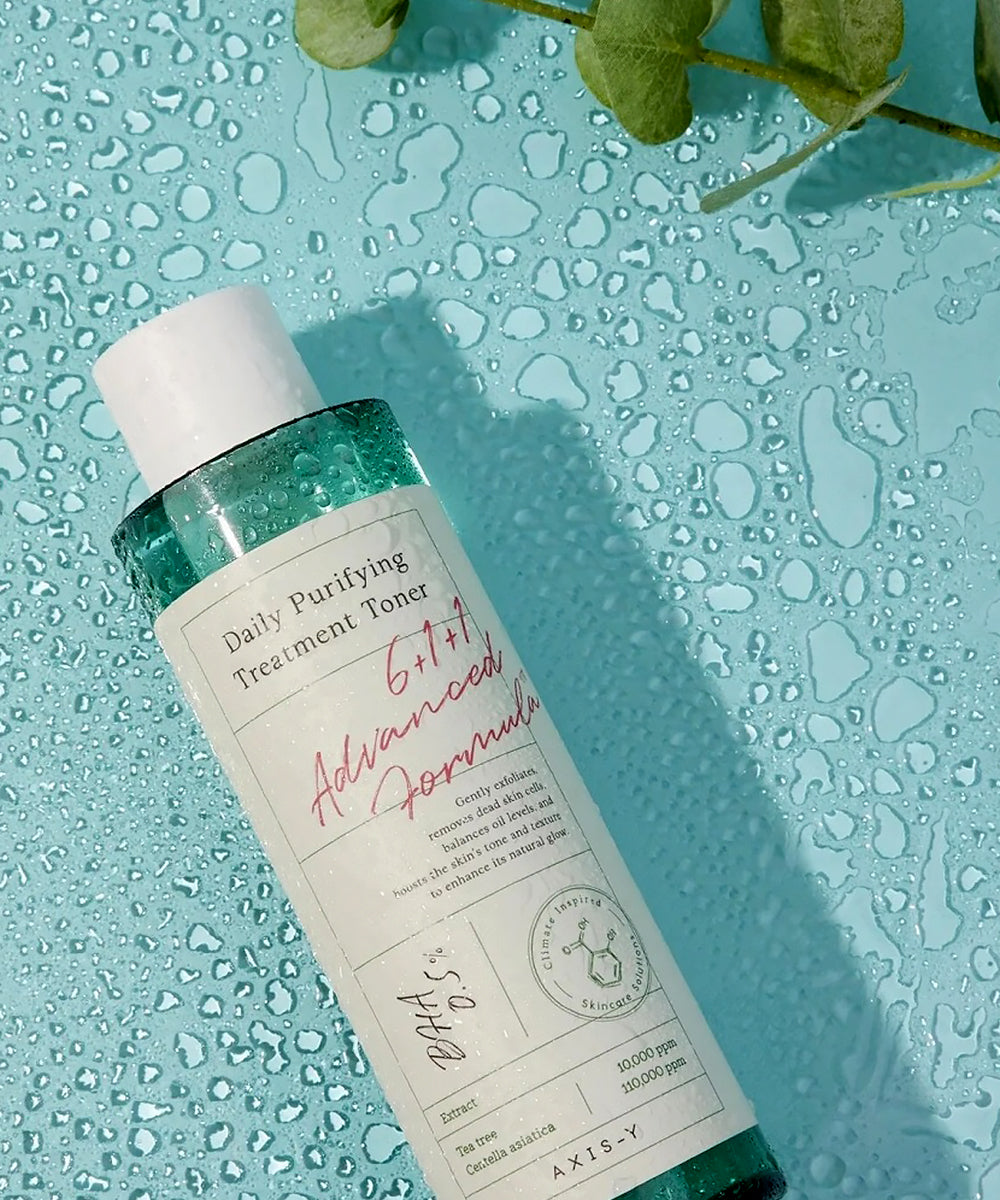 Bottle of Daily Purifying Treatment Toner on a textured blue background