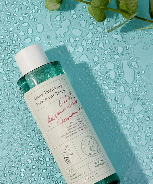 Bottle of Daily Purifying Treatment Toner on a textured blue background