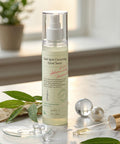 Skincare bottle labeled 'Dark Spot Correcting Glow Toner' on a marble surface with decorative elements.