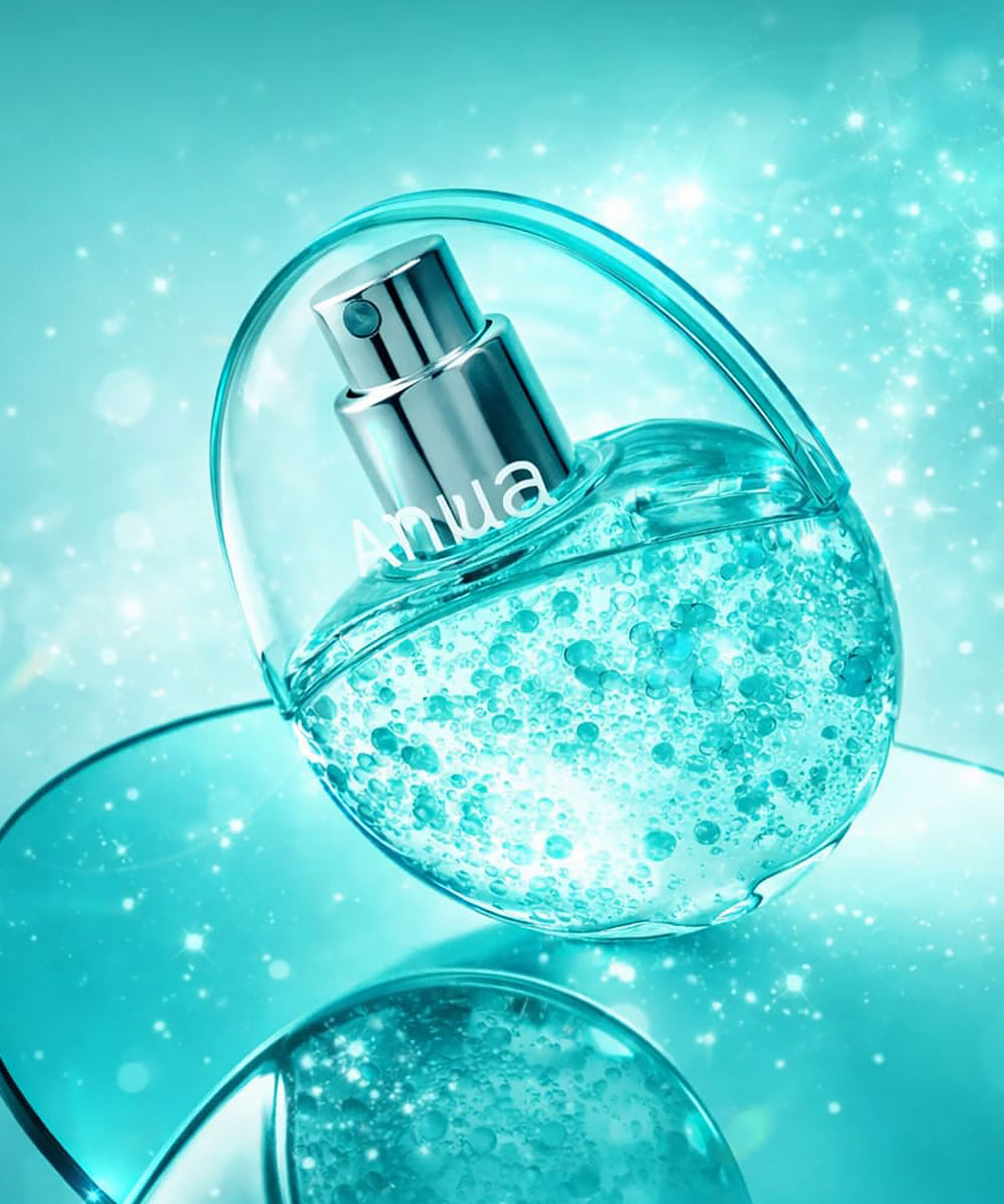 Blue perfume bottle with 'Anua' branding on a matching turquoise background