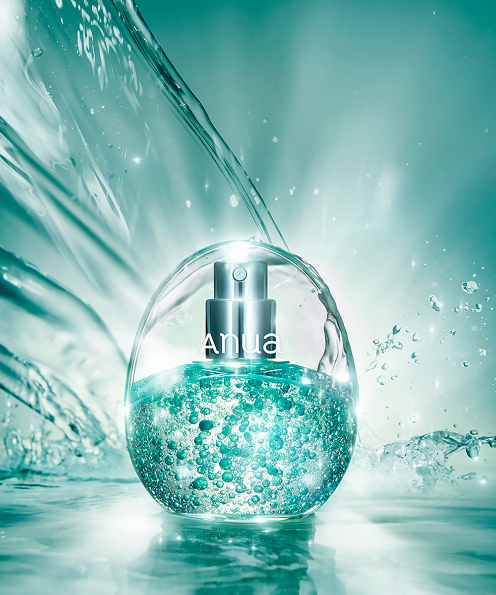 Clear dropper bottle with blue liquid and 'ANUA' branding on a teal background