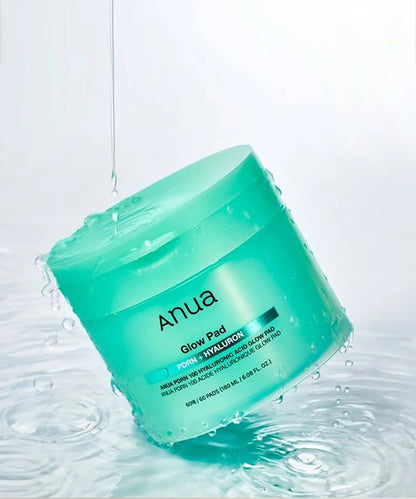 Green jar of Anua skincare product on a white background