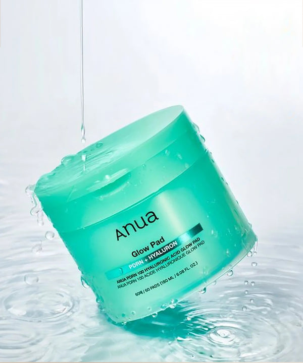 Green jar of Anua skincare product on a white background
