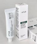 Anua heartleaf and centella cream packaging on a gray background