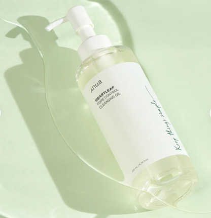 Skincare bottle with pump on a light green background