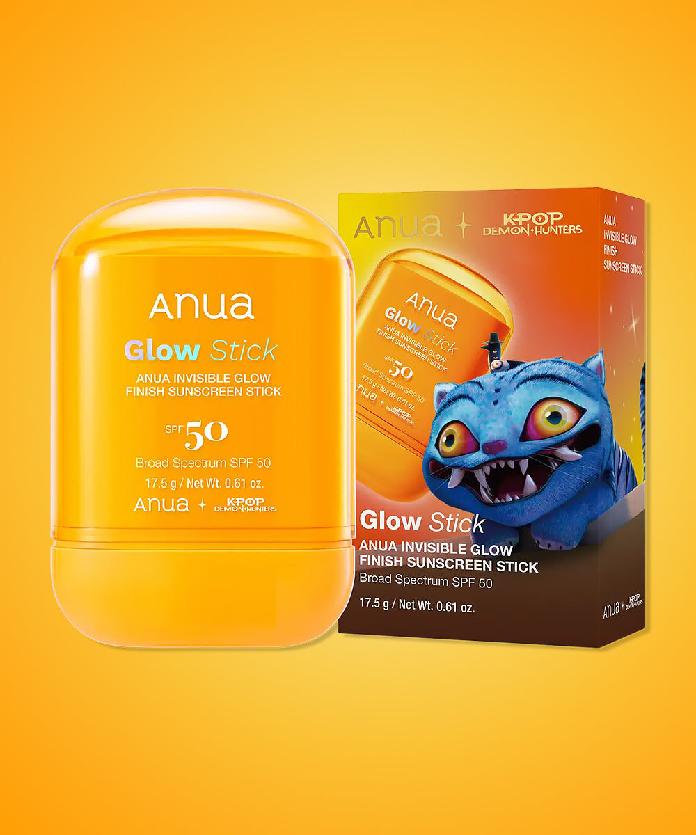 Anua Glow Stick sunscreen stick with packaging on a yellow background