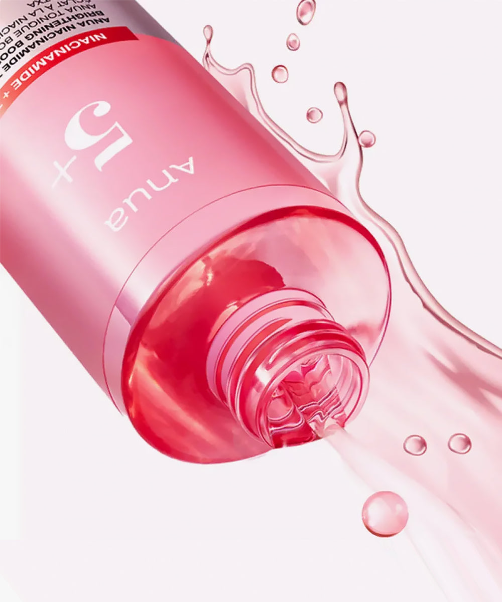 Pink bottle with liquid spilling out on a white background