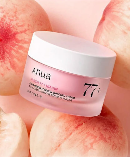 Anua Peach 77+ Niacin enriched cream jar with peach slices in the background