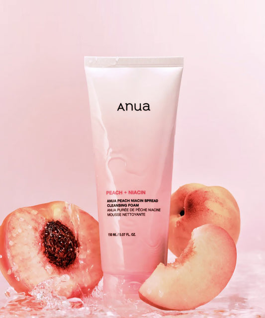 Anua Peach Niacin skincare product with peach slices on a pink background