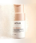 Anua cleansing powder bottle with a light beige background