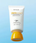 Anua Zero-Cast sunscreen tube with yellow cap on a light blue background