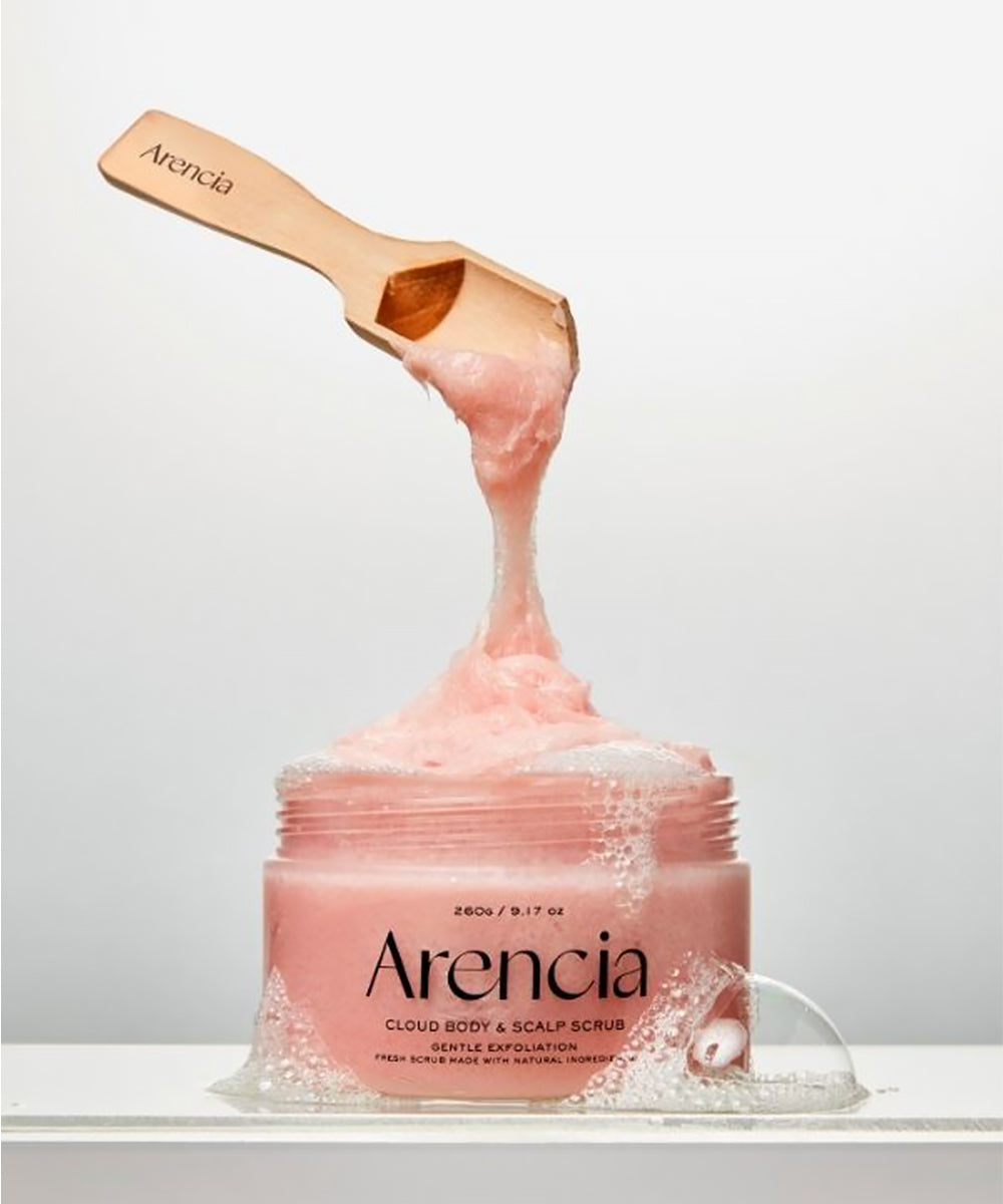 Arencia cloud body & scalp scrub with a scoop of product on a white background