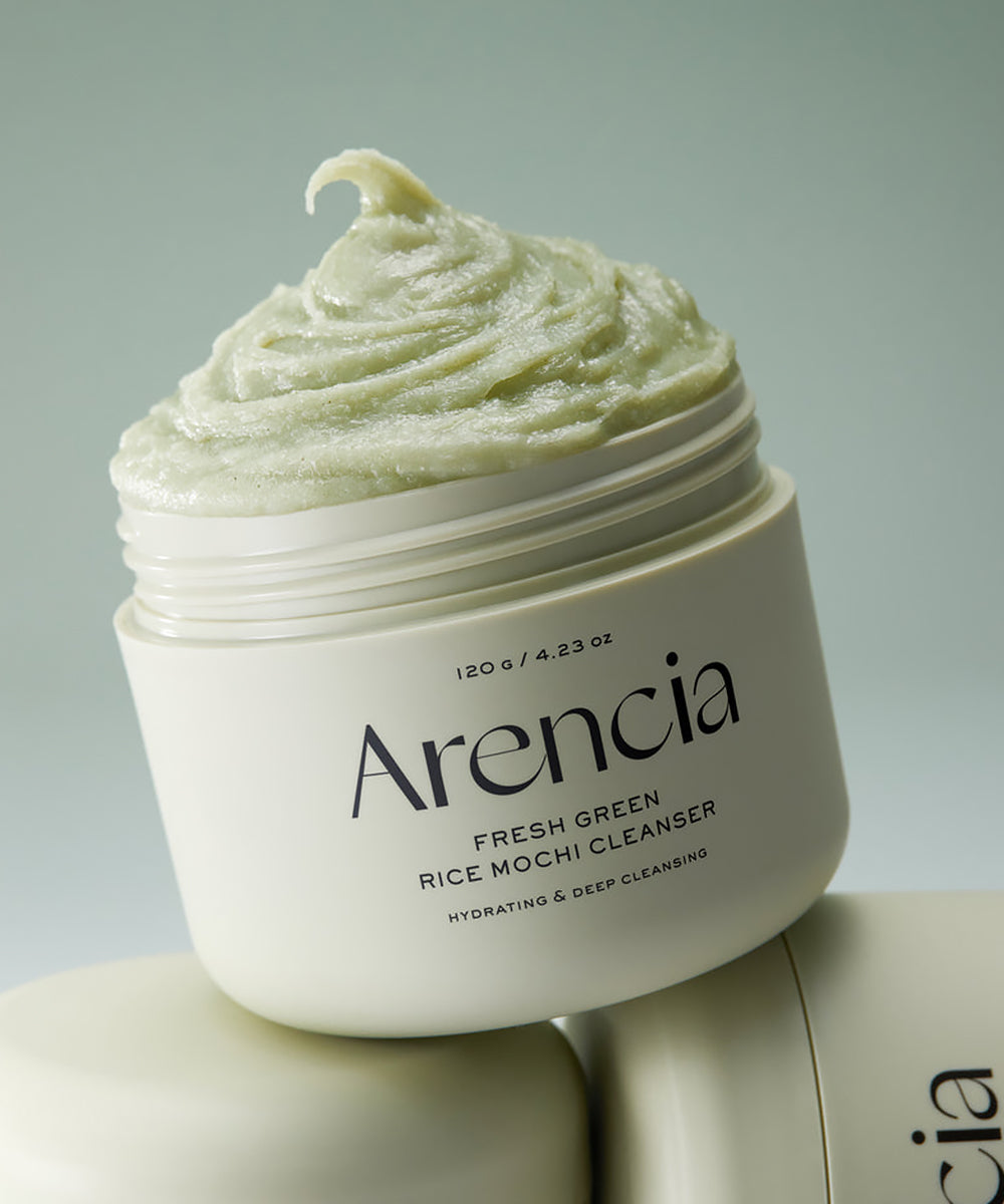 Arencia Fresh Green Rice Mochi Cleanser jar with green cream on a light gray background