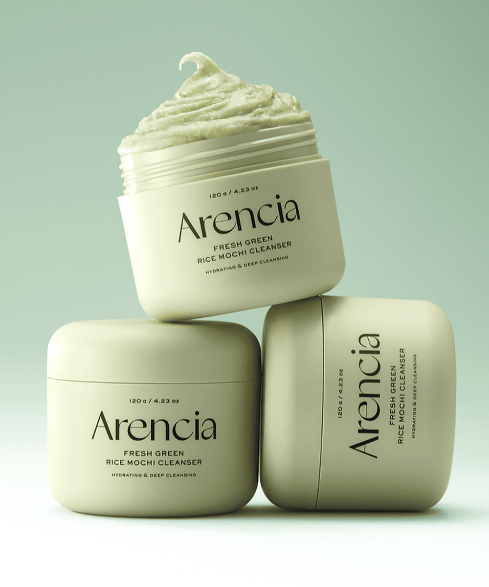 Three jars of Arencia Fresh Green Rice Mochi Cleanser on a light green background
