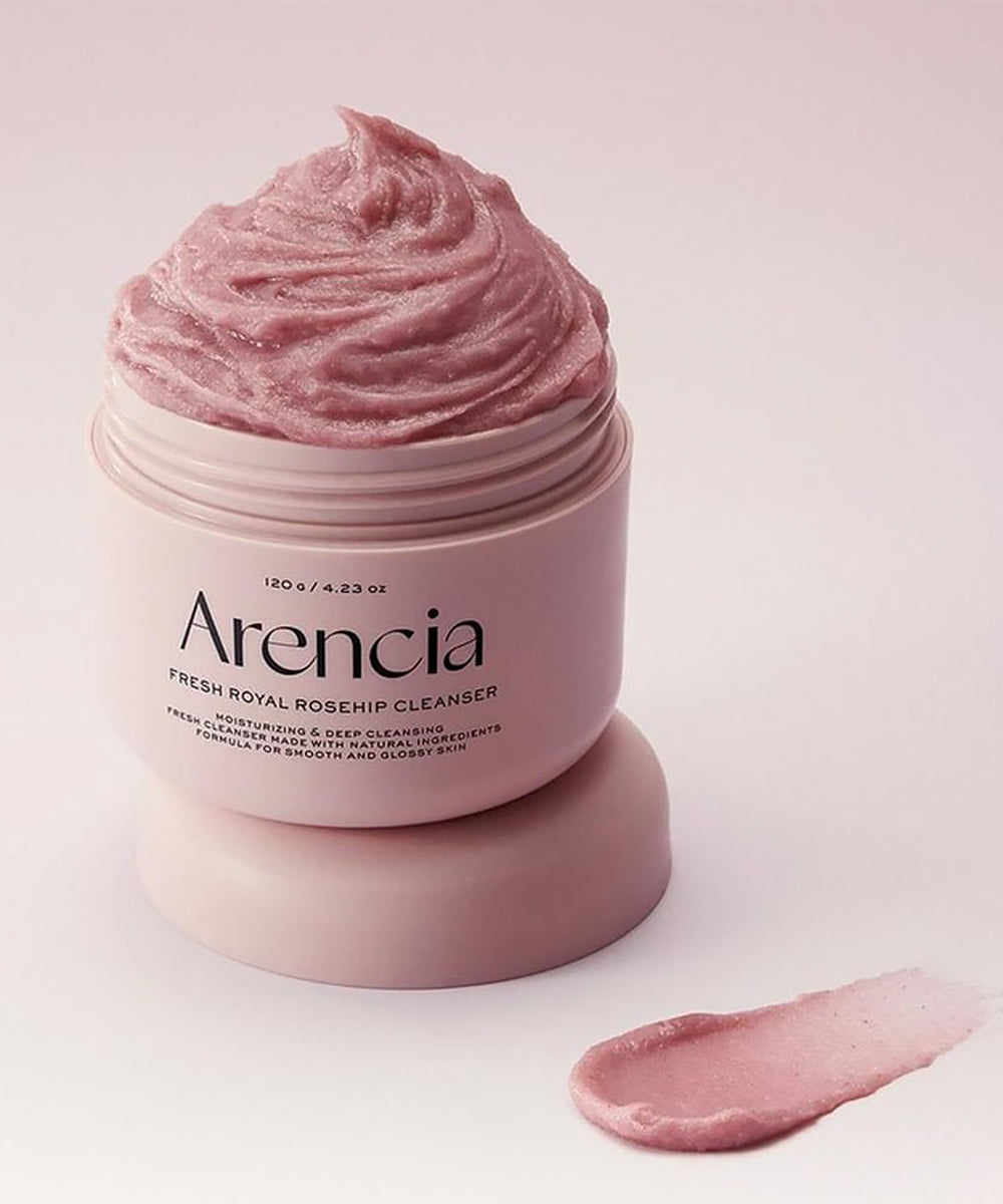 Pink skincare product jar with 'Arencia' branding on a light pink background