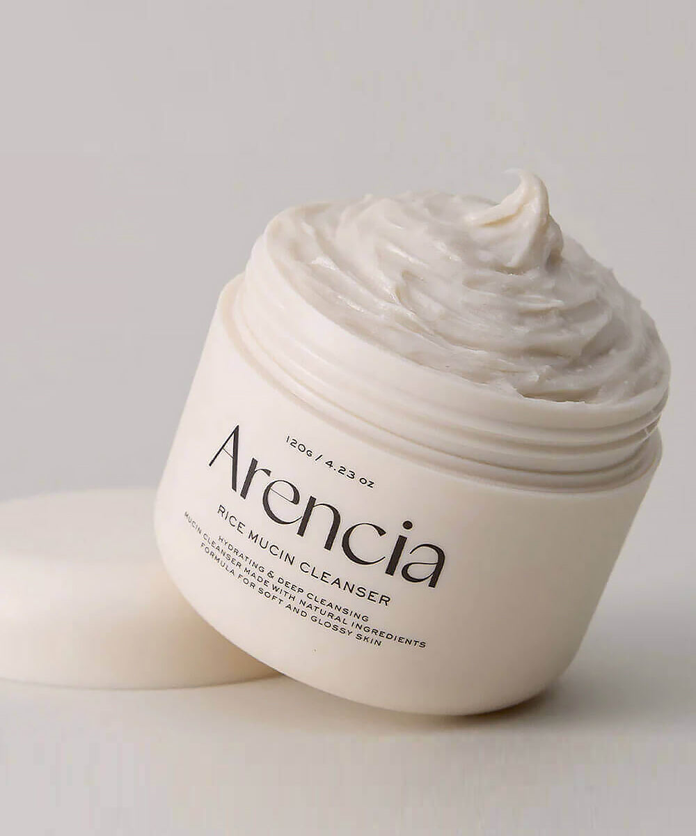 Arencia rice mucin cleanser jar with cream on a light background