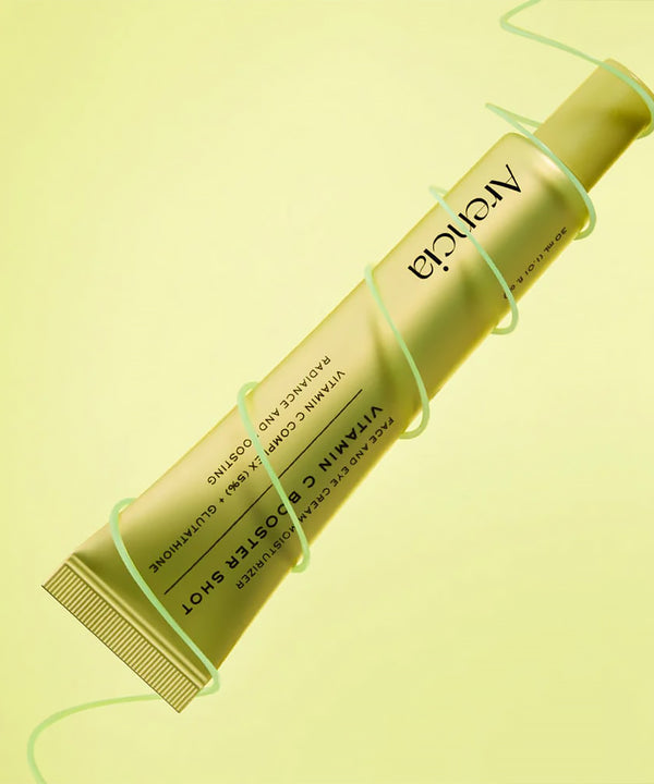 Yellow skincare product with 'Arencia' branding on a light yellow background