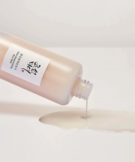 Bottle of skincare product with a label on a light background